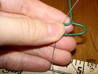 hold wire against tool