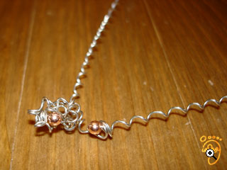 tangle coil around bead